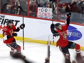 Ottawa Senators' Mark Stone (61) celebrates his goal against the Columbus Blue Jackets with teammate Zack Smith (15) during second period NHL hockey action in Ottawa on, Sunday January 22, 2017.