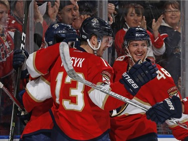 SUNRISE, FL - JANUARY 31: Mark Pysyk #13 celebrates his first period goal with Derek MacKenzie #17 and Logan Shaw #48 of the Florida Panthers during first period action against the Ottawa Senators at the BB&T Center on January 31, 2017 in Sunrise, Florida.
