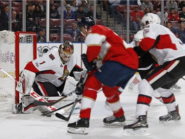 Goaltender Mike Condon #1 of the Ottawa Senators stops a shot by Shawn Thornton #22 of the Florida Panthers during first period action at the BB&T Center on January 31, 2017 in Sunrise, Florida.