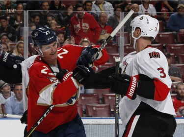 SUNRISE, FL - JANUARY 31: Nick Bjugstad #27 of the Florida Panthers tangles with Marc Methot #3 of the Ottawa Senators during second period action at the BB&T Center on January 31, 2017 in Sunrise, Florida.