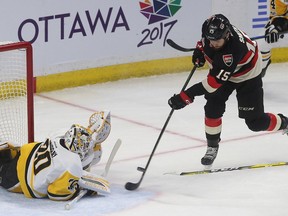 Ottawa Senators Zack Smith tries to score on Pittsburgh Penguins Marc-Andre Fleury during first period  at the Canadian tire Centre in Ottawa Thursday Jan 12, 2017.   Tony Caldwell
