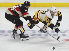 The Ottawa Senators' Mark Borowiecki tries slow down the Pittsburgh Penguins' Patric Hörnqvist during a game at the Canadian Tire Centre in January 2017.  The Senators got a chance to recharge the batteries with a day off leading up to a game against the Penguins on Thursday, March 23, 2017.