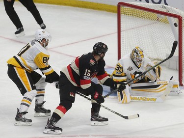 Ottawa Senators Zack tries to go top shelf on Pittsburgh Penguins Marc-Andre Fleury during second period action at the Canadian tire Centre in Ottawa Thursday January 12, 2017.   Tony Caldwell