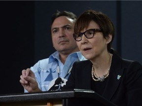 Assembly of First Nations National Chief Perry Bellegarde looks on as First Nations Child and Family Caring Society Caring Society Executive Director Cindy Blackstock speaks about the Canadian Human Rights Tribunal regarding discrimination against First Nations children in care during a news conference in Ottawa, Tuesday, January 26, 2016.