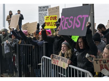 Protesters assemble at John F. Kennedy International Airport in New York.