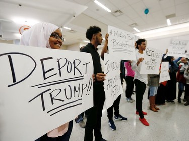 Protestors demonstrate at Dallas Forth Worth Airport.