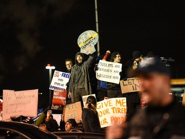 Protestors rally during a demonstration against the Muslim immigration ban at John F. Kennedy International Airport.