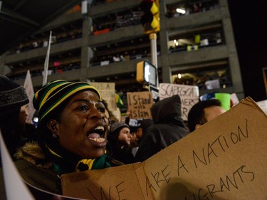 Protestors rally during a demonstration against the Muslim immigration ban at John F. Kennedy International Airport.