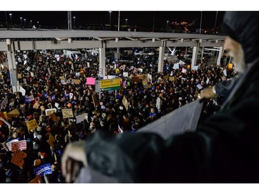 Protestors rally during a demonstration against the Muslim immigration ban at John F. Kennedy International Airport.