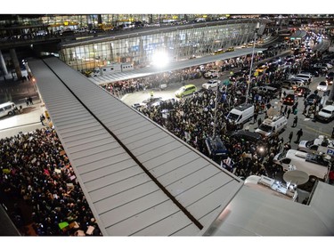 Protesters rally during a demonstration at John F. Kennedy International Airport.