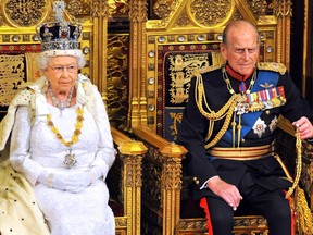 Queen Elizabeth II sits with Prince Philip, Duke of Edinburgh as she delivers her speech during the State Opening of Parliament in the House of Lords at the Palace of Westminster on June 4, 2014 in London, England.