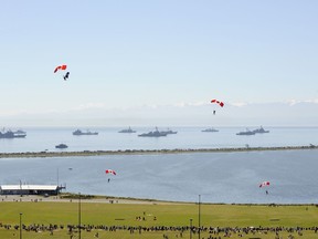 This file photo from 2010 shows Canadian Forces Skyhawks jumping on to the grounds of Royal Roads to mark the Royal Canadian Navy's Centennial, while various warships sail in the background. DND photo.