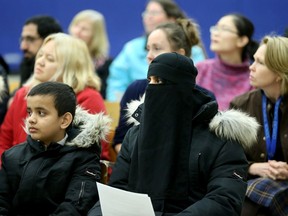 Rukhsana Hussain and her son, Syed Hameen, 9, joined about 45 residents and parents at Century Public School for a meeting to discuss a proposal to close the school.