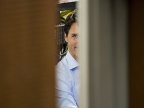 Prime Minister Justin Trudeau waits back in a side room prior to speaking with the public in a lecture hall at Health Sciences Building on the University of Saskatchewan campus in Saskatoon, Wednesday, January 25, 2017. THE CANADIAN PRESS/Liam Richards ORG XMIT: LDR114
