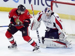The Ottawa Senators' Jean-Gabriel Pageau looks on as the puck deflects off of Washington Capitals goalie Braden Holtby during the second period at the Canadian Tire Centre on Saturday, January 7, 2017.