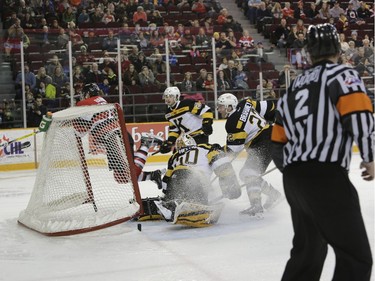 The Ottawa 67's Travis Barron crashes into the net after scoring in the second period.