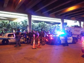 'We’re standing there and literally emergency vehicle after emergency vehicle just kept passing and passing,” recalls T.L. Rader, an Ottawa woman on the scene of Friday's shooting attack in Fort Lauderdale.