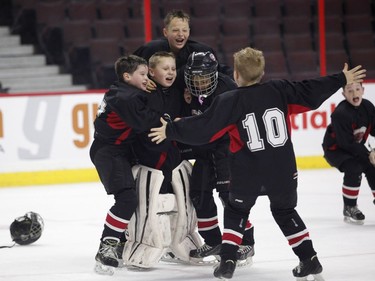 The St. Clair Shores Stars celebrate their victory over the Long Island Gulls in the Bell Capital Cup Minor Atom AAA final at the Canadian Tire Centre in Ottawa on Sunday, Jan. 1, 2017.