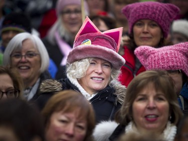 Women listen to speeches as the rally starts.