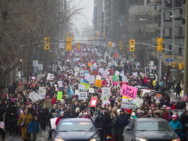 Thousands in Ottawa march down Laurier Avenue in support of the Women's March on Washington and sister organizations around the world, walking from the Human Rights Monument to the Bronson Centre Saturday January 21, 2017.