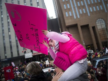 Seven-year-old Sara Poitras-George had a good view of the thousands of people at the Human Rights Monument.