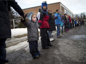 Three-year-old Tom Dulmage came out with his family on Sunday, Jan. 22, 2017 to show support for keeping J. H. Putman Public School open.