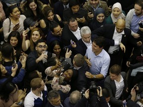 Prime Minister Justin Trudeau gets surrounded by fans and supporters at a town hall meeting at the University of Calgary in Calgary, Alta., Tuesday, Jan. 24, 2017. THE CANADIAN PRESS/Todd Korol ORG XMIT: TAK134