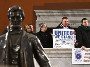 Union members listen in as protesters fill the Kentucky Capitol rotunda to speak in protest of Kentucky House Bill 1, Saturday, Jan. 7, 2017, in Frankfort, Ky. The bill, making it illegal for workers to have to join a labor union or pay dues to keep a job, was passed by the Senate, and now awaits the Governor's signature.