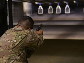 U.S. Army Sgt. 1st Class Bradford Livingston fires a M9 pistol at the 20th Security Forces Squadron combat arms range at Shaw Air Force Base, S.C., June 15, 2016. DoD photo.