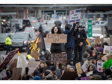 Protesters gather at JFK International Airport.