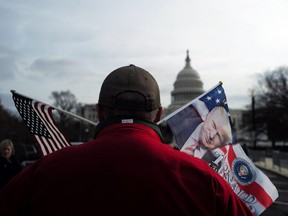 A supporter of Donald Trump walks around the capitol building in Washington on Jan. 19.