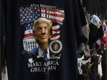 A T-shirt displays a photo of U.S. president-elect Donald Trump in a vendor booth in Washington, D.C.