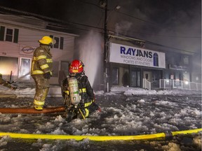 Volunteer firefighters from Casselman and Nation fire departments continue to pour water to keep a fire under control at 731 Principale Street in Casselman. Wednesday January 4, 2017.