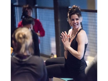 Yoga on Tap owner and head instructor Ashley Kokelj instructs the beer yoga class.