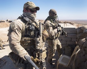 Canadian special forces look over a Peshmerga observation post, Monday, February 20, 2017 in northern Iraq. THE CANADIAN PRESS/Ryan Remiorz ORG XMIT: RYR102