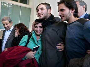 Tawfik Assali, 21, center, of Allentown, Pa., embraces his sister Sarah Assali, 19, upon her and other family members&#039; arrival from Syria at Terminal at John F. Kennedy International Airport in New York, Monday, Feb. 6, 2017. Right is Mathew Assali, 17, who arrived today. Attorneys said Dr. Assali&#039;s brothers, their wives and their two teenage children returned to Syria after they were denied entrance to the United States on Jan. 28 although they had visas in hand after a 13-year effort. (AP Phot