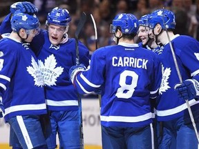Toronto Maple Leafs centre Auston Matthews (34) celebrates his goal with teammates defenceman Jake Gardiner (51) defenceman Connor Carrick (8) right wing Connor Brown (12) and centre Zach Hyman (11) during second period NHL action in Toronto on Tuesday, February 7, 2017.