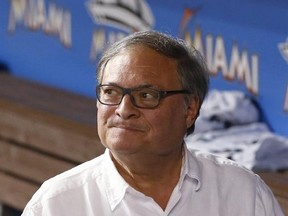 FILE - In this May 31, 2016, file photo, Miami Marlins owner and CEO Jeffrey Loria walks through the dugout after a baseball game between the Marlins and the Pittsburgh Pirates, in Miami. A person with direct knowledge of the negotiations says Miami Marlins owner Jeffrey Loria has a preliminary agreement to sell the team to a New York businessman, but the deal could fall through because the final purchase price hasn‚Äôt been determined. The person spoke to The Associated Press on condition of an