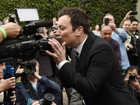 Jimmy Fallon, host of the 74th Annual Golden Globe Awards, kisses a camera after rolling out the red carpet during Golden Globes Preview Day at the Beverly Hilton on Wednesday, Jan. 4, 2017, in Beverly Hills, Calif. The awards will be held on Sunday. The job of hosting an awards show seems to be even more treacherous these days, with political tensions running high in the U.S. and some viewers hoping for fun escapism and others expecting biting commentary on what&#039;s happening in the world. THE CA