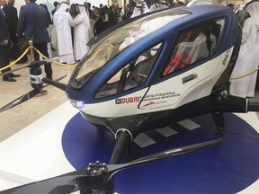 A model of EHang 184 and the next generation of Dubai Drone Taxi is seen during the seconde day of the World Government Summit in Dubai, United Arab Emirates, Monday, Feb. 13, 2017. Dubai hopes to have a passenger-carrying drone buzzing through the skyline of this futuristic city-state in July. Mattar al-Tayer, the head of Dubai&#039;s Roads & Transportation Agency, made the surprise announcement Monday at the World Government Summit. (AP Photo/Jon Gambrell)