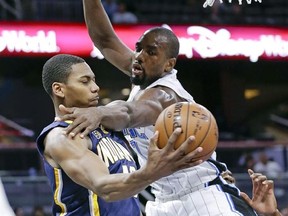 Indiana Pacers&#039; Glenn Robinson III, left, passes the ball as Orlando Magic&#039;s Serge Ibaka defends during the first half of an NBA basketball game, Wednesday, Feb. 1, 2017, in Orlando, Fla. The Toronto Raptors have finally got the defensive big man they&#039;ve been coveting.A source tells The Canadian Press that the Raptors have acquired Ibaka from the Orlando Magic for Terrence Ross plus a first-round pick in the 2017 NBA draft. THE CANADIAN PRESS/AP/John Raoux