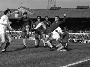 FILE - In this Oct. 18, 1969 file photo, Chelsea&#039;s Eddie McCreadie, second right, kicks clear from scrimmage in front West Bromwich&#039;s Jeff Astle, left, during the English League Division one soccer match between Chelsea and West Bromwich Albion at Stamford Bridge Stadium in London. The degenerative damage potentially caused by repeated blows to the head in soccer has been highlighted by a rare study of brains of a small number of retired players who developed dementia, released on Wednesday, Feb