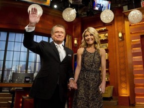 FILE - In this Friday, Nov. 18, 2011, file photo, Regis Philbin and Kelly Ripa appear on Regis&#039; farewell episode of &ampquot;Live! with Regis and Kelly&ampquot;, in New York. Philbin said he hasn&#039;t kept in touch with Ripa, his former co-host, since he decided to leave the show they headlined together. (AP Photo/Charles Sykes, File)