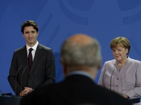 Canadian Prime Minister Justin Trudeau participates in a joint news conference with German Chancellor Angela Merkel at the Chancellery in Berlin, Germany Friday, February 17, 2017. THE CANADIAN PRESS/Adrian Wyld