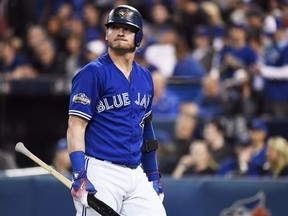 Toronto Blue Jays&#039; Josh Donaldson (20) reacts after striking out against the Texas Rangers during seventh inning American League Division Series action, in Toronto on Sunday, October 9, 2016.Donaldson will likely miss the first couple of weeks of spring training with a right calf strain. THE CANADIAN PRESS/Nathan Denette