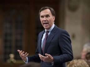 Minister of Finance Bill Morneau rises during Question Period in the House of Commons on Parliament Hill, Thursday, Feb. 16, 2017 in Ottawa. THE CANADIAN PRESS/Justin Tang