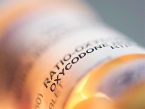 Prescription pill bottle containing oxycodone and acetaminophen is shown on June 20, 2012. Young children whose mothers have been prescribed an opioid are at an increased risk of being hospitalized for an overdose from the potent pain medications, most often through accidental ingestion, a study has found. THE CANADIAN PRESS/Graeme Roy