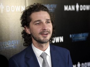FILE - In this Nov. 30, 2016 file photo, Shia LaBeouf arrives at the Los Angeles premiere of &ampquot;Man Down&ampquot; at ArcLight Cinemas Hollywood. LaBeouf has brought a performance-art piece against President Donald Trump to New Mexico&#039;s largest city. The Albuquerque Journal reports that LaBeouf, along with two other artists, brought on Saturday, Feb. 18, 2017, a 24-hour live-streaming camera mounted to a wall with the message in block letters: &ampquot;He will not divide us,&ampquot; referring to Trump. (Photo by Chris Pi