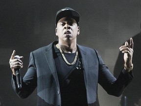 FILE - In this Nov. 4, 2016 file photo, Jay Z performs during a campaign rally for Democratic presidential candidate Hillary Clinton in Cleveland. Jay Z will become the first rapper ever inducted into the Songwriters Hall of Fame when he enters the prestigious organization in June. The Songwriters Hall announced Wednesday, Feb. 22, 2017, that songwriting heavyweights in the industry, including Kenneth ‚ÄúBabyface‚Äù Edmonds, Max Martin and Jimmy Jam & Terry Lewis will also be part of its 2017 cl