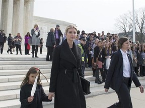 Ivanka Trump, daughter of President Donald Trump, and her daughter Arabella Kushner walk down the steps of the Supreme Court in Washington, Wednesday, Feb. 22, 2017. Trump attended the court session at the encouragement of Justice Anthony Kennedy, who extended her an invitation when they met at the inauguration lunch. (AP Photo/Molly Riley)